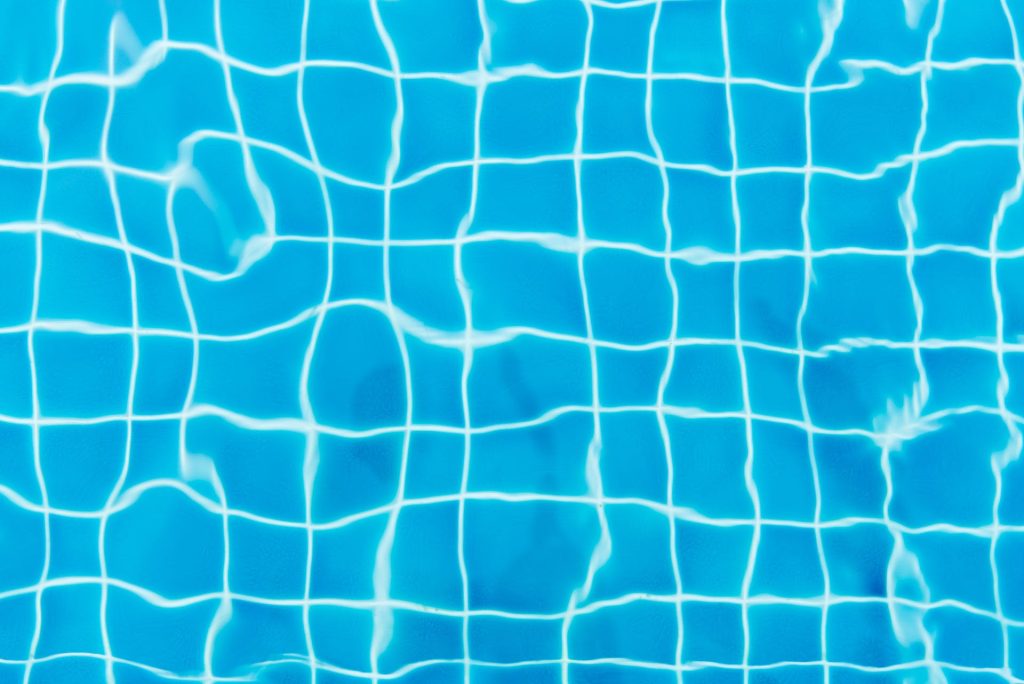 top view photography of blue pool tiles